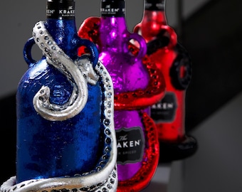 Três Krakens Brilhantes - 3 Garrafas Kraken Originais, o Kraken Pop Art, o Kraken Metálico e o Kraken Moderno (VAZIOS)