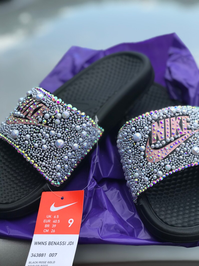 purple and gold nike slides