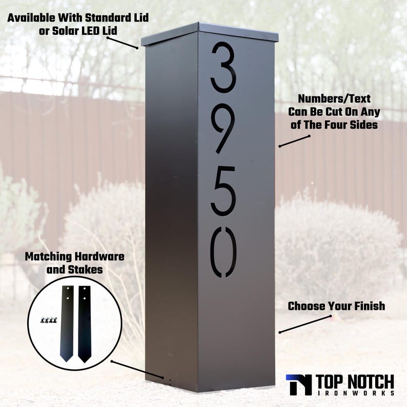 May include: A black metal address post with the numbers 3950 cut out. The post is rectangular and has a flat top. Text on the image says "Available With Standard Lid or Solar LED Lid" and "Numbers/Text Can Be Cut On Any Of The Four Sides."