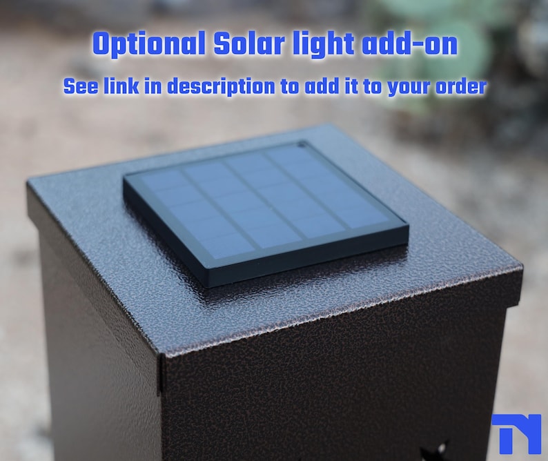 May include: A dark brown metal box with a solar panel on top. The solar panel is black and has a grid pattern. The text "Optional Solar light add-on" is in blue above the box.