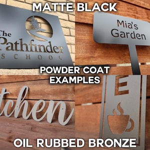 May include: Two metal signs with different finishes. The top sign is matte black and says "The Pathfinder School". The bottom sign is oil rubbed bronze and says "kitchen".
