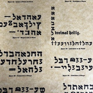 May include: A close-up of a page from a book with black text on a beige background. The text is in Hebrew and German. The text includes the words "dreimal heilig" and "Magical Laws of Moded".