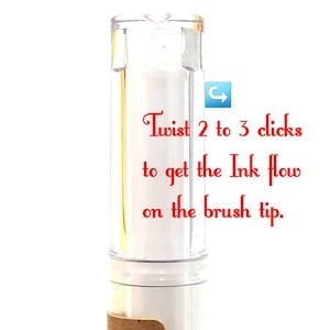 May include: A clear plastic bottle with a white label that says "DINK Pen." The bottle has a white cap and a white brush tip. The text "Twist 2 to 3 clicks to get the Ink flow on the brush tip." is written in red on a white background.