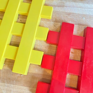 Copco trivets heat resistance, in great shape. Set of 2, one yellow one red