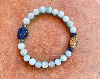 Lapis lazuli skull, pyrite, Labradorite, and blue sapphire stretch bracelet