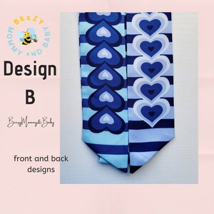 May include: Two blue and white fabric strips with a heart pattern. The fabric strips are sewn together at the top and bottom. The fabric strips are designed with a blue and white striped pattern and a blue heart pattern. The text "Design B" is visible in the image.