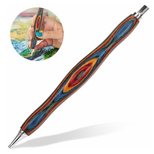 May include: A colorful wooden diamond painting pen with a silver tip. The pen has a blue, red, yellow, and green wood grain pattern.
