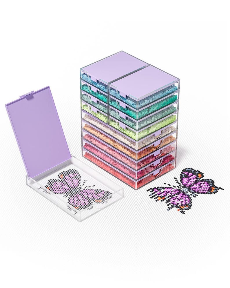 May include: A craft kit with a butterfly design. The kit includes a stack of clear plastic drawers filled with colorful beads, a tray with a butterfly design, and a completed butterfly design. The kit is designed for crafting.