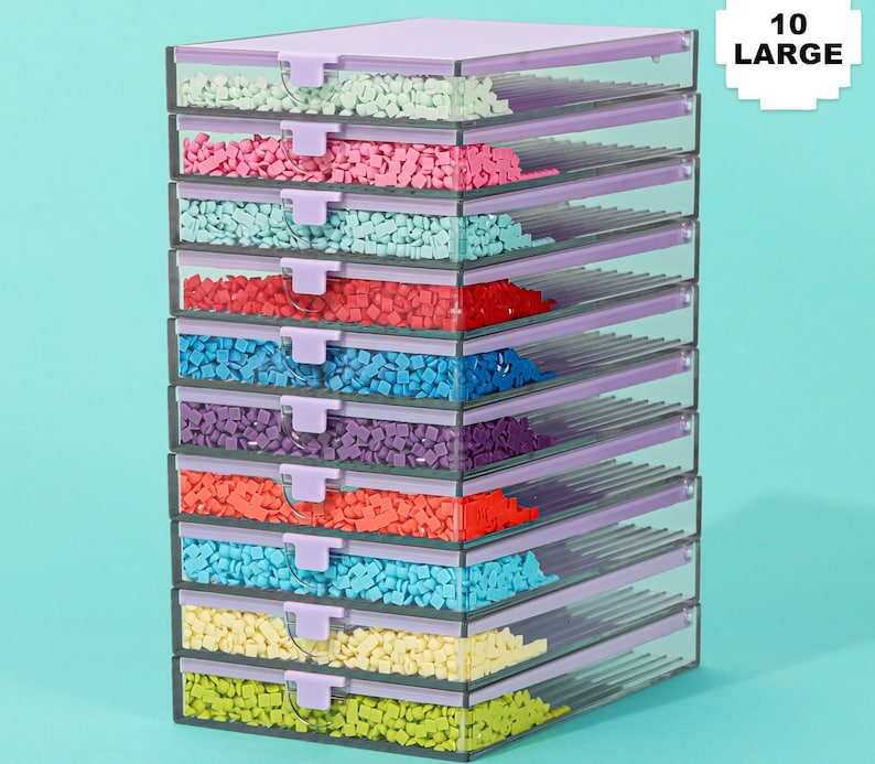 May include: A stack of ten clear plastic storage containers with lavender lids and clasps. Each container is filled with small, colorful, square-shaped objects. The containers are arranged in a neat, organized manner, with the text "10 LARGE" in the upper right corner.