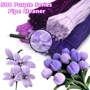 May include: 500 Purple Series Pipe Cleaner. A close-up of a bundle of purple pipe cleaners. The pipe cleaners are 0.6cm/0.23 inch in diameter. The pipe cleaners are arranged in a stack, with the top layer being the lightest purple and the bottom layer being the darkest purple. The pipe cleaners are used to make crafts, such as flowers and animals.