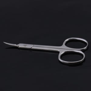 May include: A pair of silver-toned cuticle scissors with curved blades. The scissors are designed for trimming cuticles and hangnails.