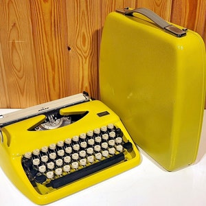 Adler Tippa Yellow Typewriter: Vintage Portable QWERTY/QWERTZ with Case