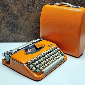 Retro Orange Olympia Typewriter: Mid-Century Portable Manual Machine