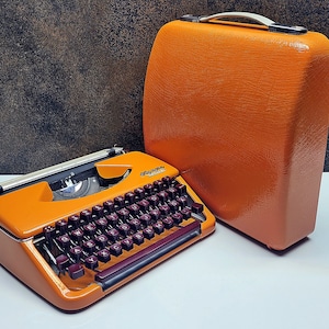 German-Made Olympia Splendid 33/66 Orange Manual Typewriter | Refurbished Vintage Writing Machine with Burgundy Keys & Case | Rare Gift