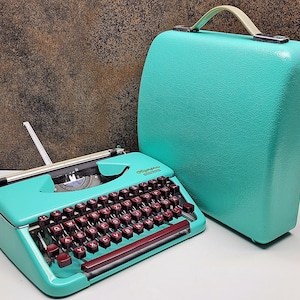 Restored Olympia Splendid Typewriter: Black & Grey, Mid-Century Collectible