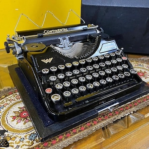Continental Typewriter: Vintage Black Typewriter with Glass Keyboard
