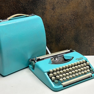 Antique Turquoise Olympia Typewriter: Mid-Century Writing Machine with Case