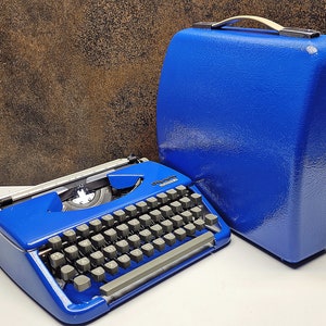 Vintage Olympia Splendid Typewriter: Retro Blue Manual Machine, 1960s