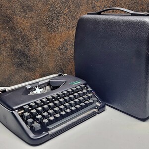 Vintage Olympia Splendid 33/66 Typewriter: Black Keys, Portable, Restored