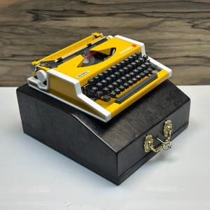 Yellow Olympia Traveller Typewriter with Wooden Case: Retro Portable Manual
