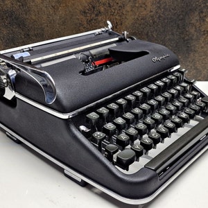 Olympia SM3 Black Typewriter: Restored Vintage Collectible with Bag