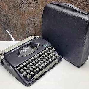 Restored Olympia Splendid Typewriter: Black & Grey, Mid-Century Collectible