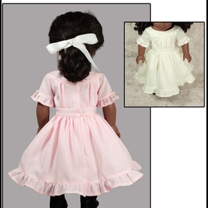 May include: A PDF sewing pattern titled Adelaide's 1850's Dress designed to fit 18" dolls. The image shows a doll wearing a light pink dress with short ruffled sleeves, a gathered skirt, and a white hair ribbon, plus a white dress version.