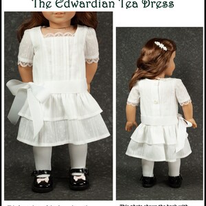 May include: A white doll dress with a square neckline, short sleeves, and a tiered skirt. The dress features a white bow at the waist and is paired with white tights and black shoes. The text reads "The Edwardian Tea Dress".