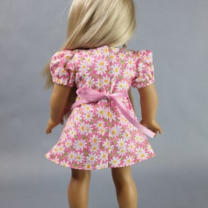 This 18 inch doll Shirred Front Dress PDF Sewing pattern is styled from the 1970s. This dress has a center front panel with shirring in the bodice extends to the skirt. There are two options for shirring in the center front panel. You may sew gathers and then apply a ⅛ to ¼ inch ribbon or gather the front section with elastic for a smocked effect. There are two sleeve options for the dress: a puff sleeve option or sleeveless. The neckline on dress is square and the skirt is semi-full.