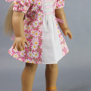 This 18 inch doll Shirred Front Dress PDF Sewing pattern is styled from the 1970s. This dress has a center front panel with shirring in the bodice extends to the skirt. There are two options for shirring in the center front panel. You may sew gathers and then apply a ⅛ to ¼ inch ribbon or gather the front section with elastic for a smocked effect. There are two sleeve options for the dress: a puff sleeve option or sleeveless. The neckline on dress is square and the skirt is semi-full.