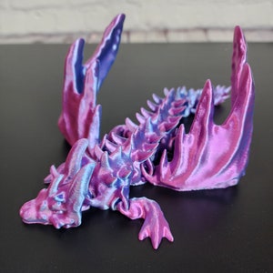 Gegliederte geflügelte Drache-Fidget einzigartige Designs