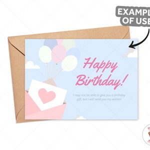 May include: A birthday card with a light blue backdrop, displaying the text "Happy Birthday!" in pink. The card features illustrations of balloons, clouds, and an envelope with a heart. The card is placed inside a brown envelope.