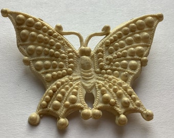 broche papillon en plastique vintage