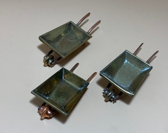 3 brass wheelbarrows