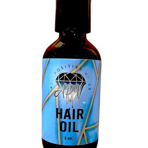 May include: A 2 ounce bottle of hair oil with a blue and gold label. The label features a diamond with the letters APV inside and the words "Hair Oil".