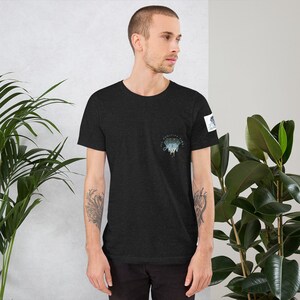 May include: A black t-shirt with a blue and green diamond graphic that says "All positivity vibes".
