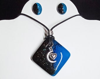 Black Dichroic and Teal Glass Pendant with Silver Tone Crescent Moon and Heart; Set Includes Matching Earrings