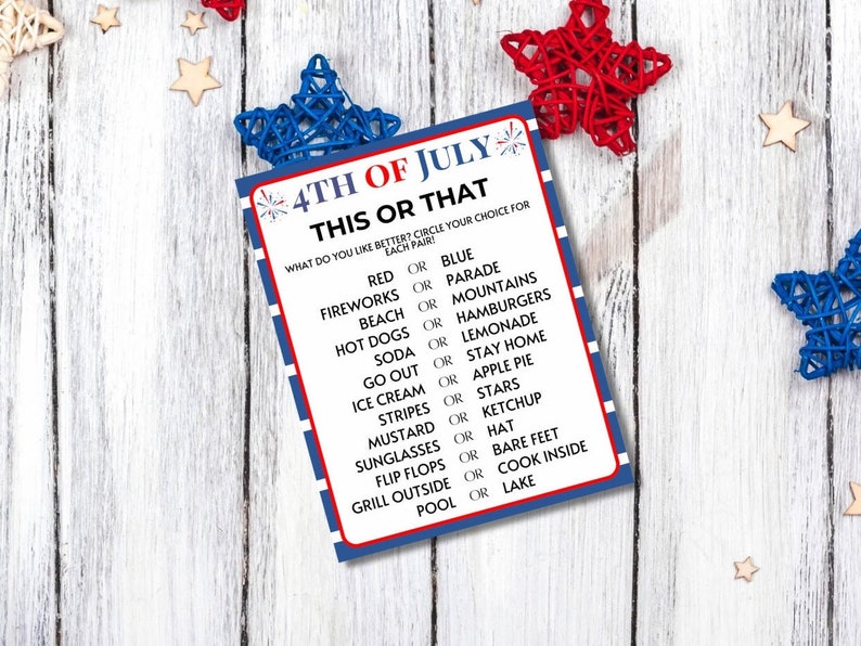 May include: A patriotic 4th of July game card with a red, white, and blue border. The card features the text "4TH OF JULY THIS OR THAT" and prompts players to choose between pairs of summer-themed options like "Fireworks or Parade."