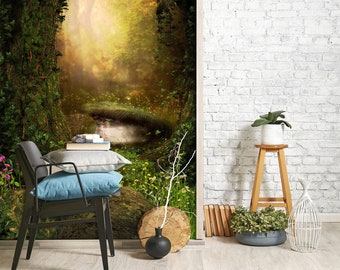 May include: A photo mural depicting a magical forest scene with a mossy path leading into the woods. The path is lined with lush greenery and sunlight streams through the trees. The mural is perfect for creating a serene and enchanting atmosphere in any room.