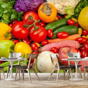 May include: A colorful assortment of fresh produce, including red tomatoes, green peppers, yellow peppers, carrots, cucumbers, and a red apple.