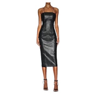 May include: A black, sleeveless midi dress with a fitted silhouette and a textured, crocodile-embossed fabric. The dress has a square neckline and thin straps.
