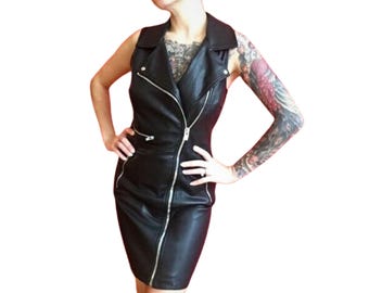 May include: A black leather sleeveless dress with a zipper closure and a collar. The dress has a fitted silhouette and a short length.