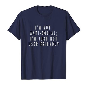 May include: Navy blue t-shirt with the white text: "I'M NOT ANTI-SOCIAL; I'M JUST NOT USER FRIENDLY." The shirt is a casual wear item, suitable for everyday use. The text is centered on the front of the shirt.