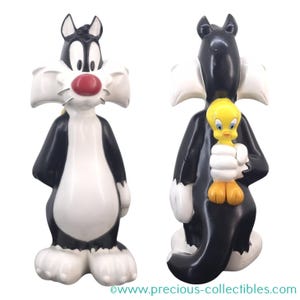 Extremely rare! Vintage Tweety Bird and Sylvester Mid  Fig. Sylvester is holding Tweety behind his back. Warner Bros Movie Store