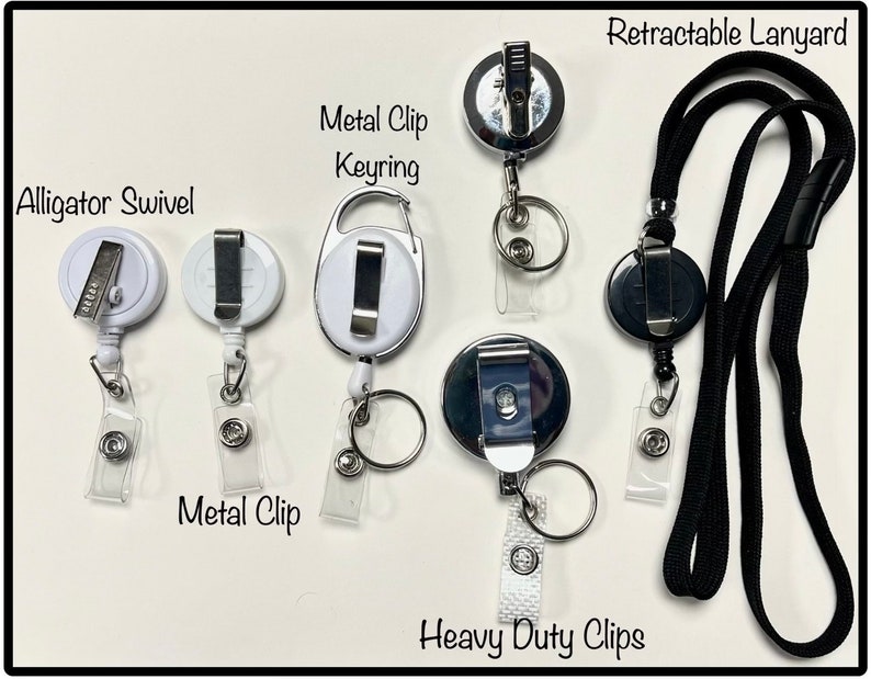 May include: A collection of retractable lanyards and badge holders. The image shows various styles, including those with alligator swivels, metal clips, keyrings, and heavy-duty clips. The lanyards are black, and the badge holders are white or silver.