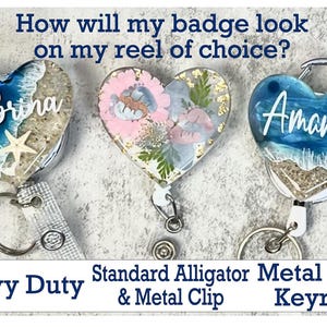May include: Heart-shaped badge reels with personalized names, featuring ocean and floral designs. The badge reels have a metal clip and keyring. The text on the image reads: "How will my badge look on my reel of choice?"
