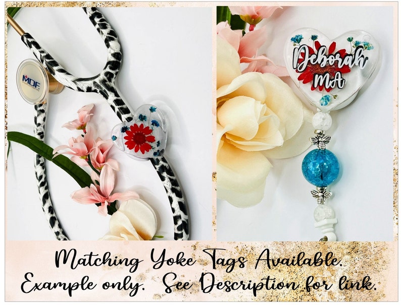 May include: A stethoscope with a black and white spotted design, paired with a heart-shaped badge reel. The badge reel features a red flower and the name "Deborah MA". The image also includes text that reads "Matching Yoke Tags Available. Example only. See Description for link."