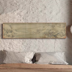 May include: A brown wooden bed frame with a brown linen duvet and two white pillows. A long, horizontal painting of a landscape scene hangs above the bed on a textured gray wall. A round, white light fixture is mounted on the wall to the right of the bed.