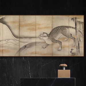 May include: A black marble countertop with a gold metal base and a small vase with green plants on a gold metal stand. A black and white painting of a tiger in a bamboo forest hangs on the wall behind the countertop.