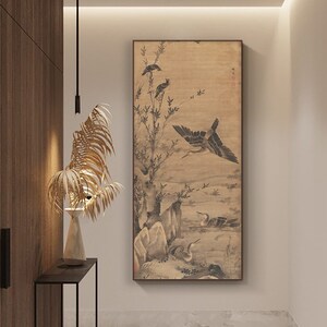 May include: A black and white ink painting of birds on a branch with a light brown background. The painting is framed in a thin, dark brown frame.